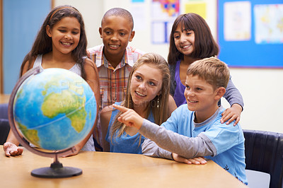 Buy stock photo Students, children with globe and learning map in classroom for education, teaching and quiz or group support. Happy kids with planet earth, world and geography for 3d knowledge of history in school