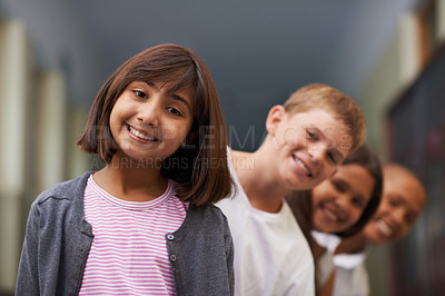 Buy stock photo Girl, portrait and friends in row at school with confidence and pride for learning, education or knowledge. Student, people and face with smile in building or hallway before class or ready to study