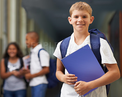 Buy stock photo Boy, portrait and happy in corridor of school with backpack and books for learning, education or knowledge. Student, person and face with smile in building or hallway before class or ready to study  