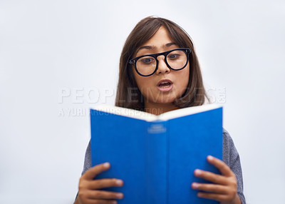 Buy stock photo Child, book and reading for development in education, information and knowledge by white background. Girl, student and learning or studying in studio, academy and notebook for story and growth