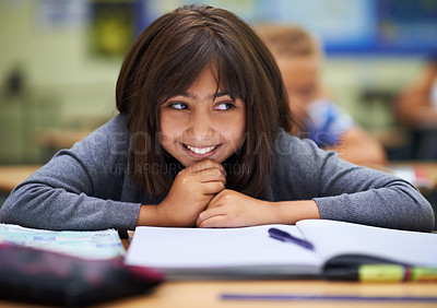 Buy stock photo Girl, education and happy in classroom for learning, information and notes for knowledge in school. Female person, book and confidence for assessment or test, studying lesson and smiling at academy
