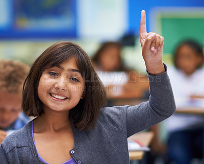 Buy stock photo Girl, portrait and raise hand in classroom, elementary school and answer teacher question. Students, study and childhood development for education, knowledge and academic information for people