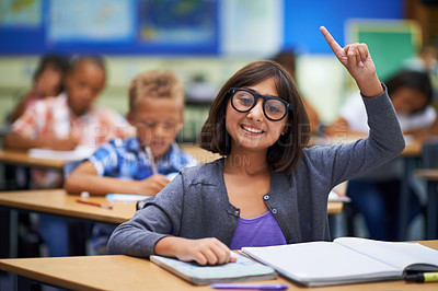 Buy stock photo Girl, portrait and raise hand in class, elementary school and answer teacher question. Students, study and childhood development for education, knowledge and academic information for people

