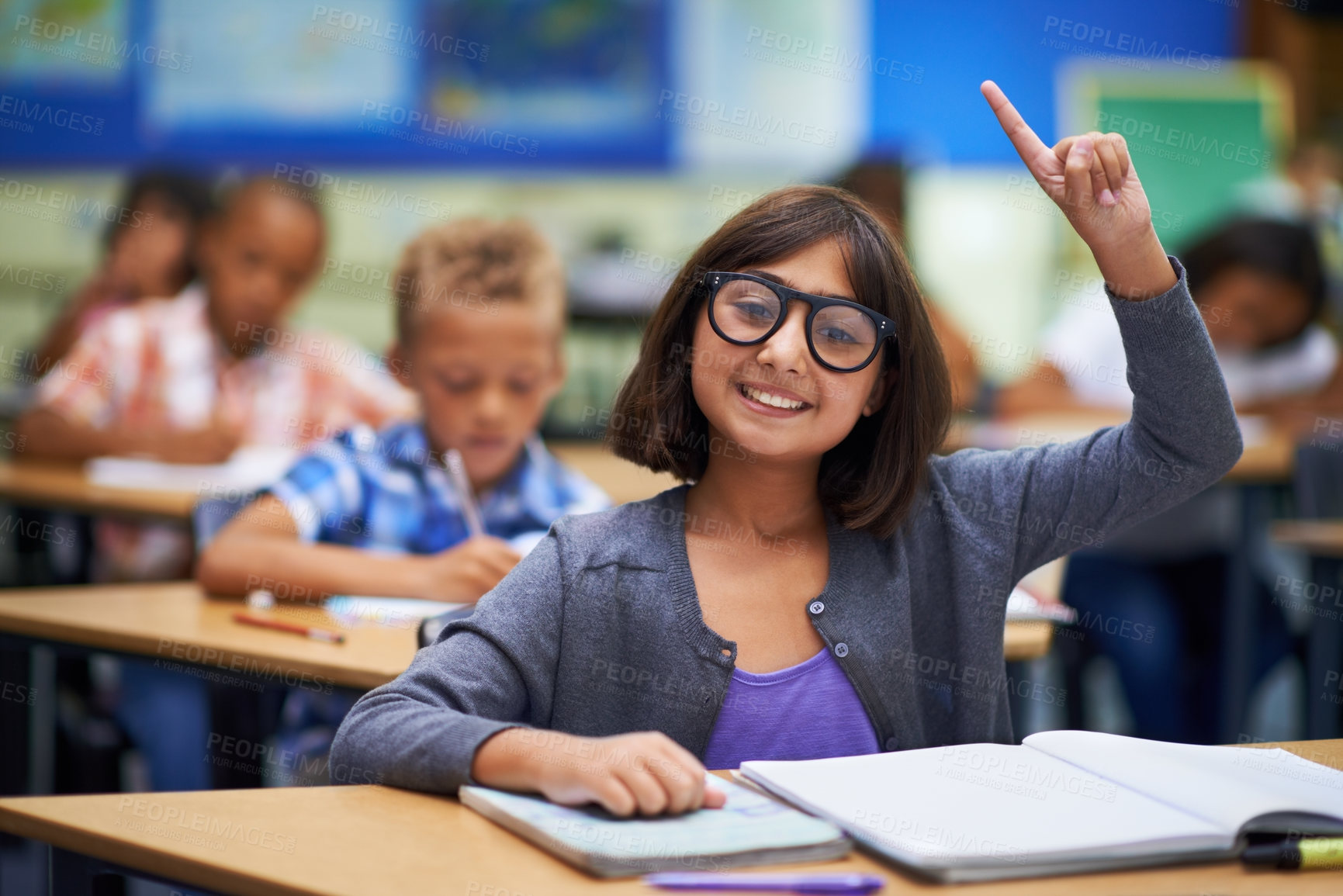 Buy stock photo Girl, portrait and raise hand in class, elementary school and answer teacher question. Students, study and childhood development for education, knowledge and academic information for people
