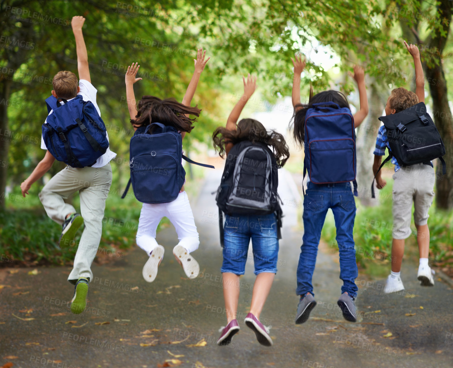 Buy stock photo Rear view of excited schoolchildren jumping in a row