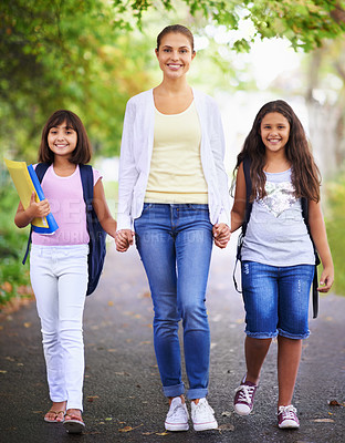 Buy stock photo Mother, daughter and holding hands in street for school with portrait, happiness and backpack or books. Family, woman and children in road with support for education, learning and parenting with love
