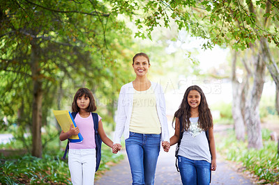 Buy stock photo Mother, daughter and holding hands outdoor for school with portrait, happiness and backpack or books. Family, woman and children in park with support for education, learning and parenting with love