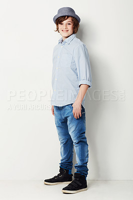 Buy stock photo Cool, stylish and portrait of a child in fashion isolated on a white background in a studio. Happy, fashionable and a young boy model in jeans and clothes for style, happiness and confidence