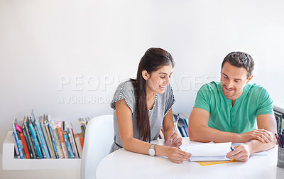 Buy stock photo Collaboration, planning and design with a creative team talking while reading documents in their office. Teamwork, meeting or strategy with a man and woman designer in discussion over creativity