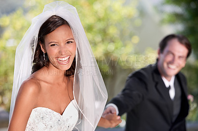 Buy stock photo Laugh, woman and man holding hands at wedding with smile, love and commitment at outdoor reception. Romance, bride and groom at marriage celebration with nature, loyalty and happy future together.