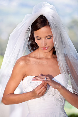 Buy stock photo A young bride admiring her wedding ring