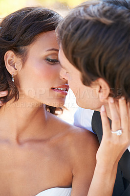 Buy stock photo Kiss, woman and man at wedding with love, embrace and commitment at outdoor reception. Romance, face of bride and groom at marriage celebration with nature, loyalty and couple with future together.