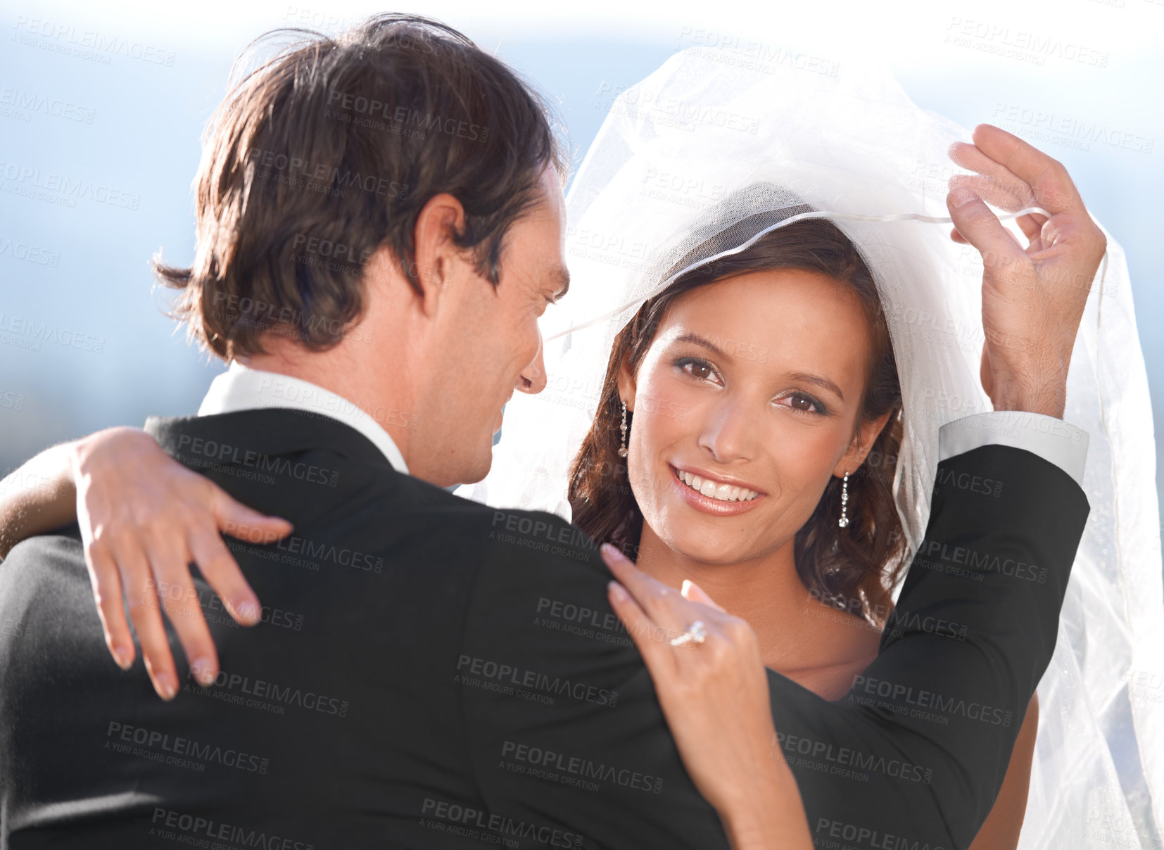 Buy stock photo Portrait, happy woman and man embrace at wedding with smile, love and commitment at outdoor reception. Romance, face of bride and groom at marriage celebration with sky, loyalty and future together.