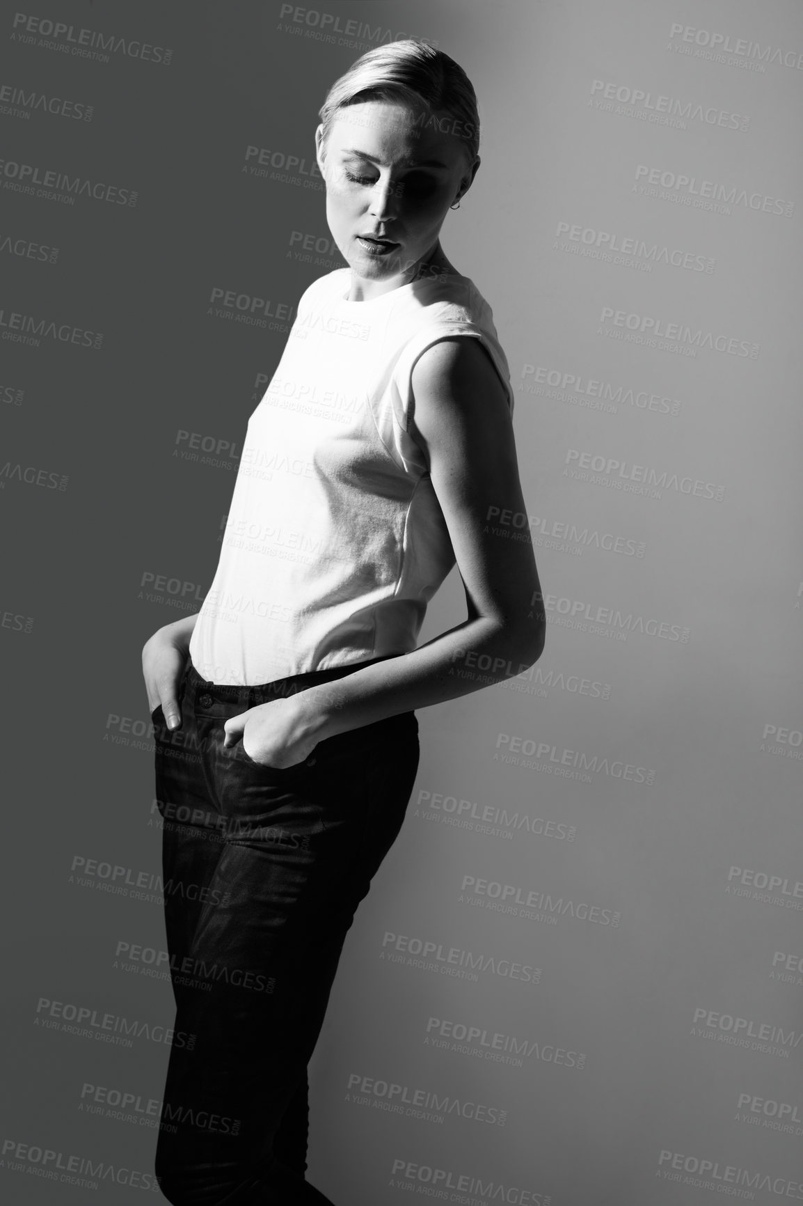 Buy stock photo Woman, black and white in studio for fashion, retro or classic aesthetic by gray background with light. Isolated model, edgy outfit or clothes with vintage style, lady or pose with art deco in studio