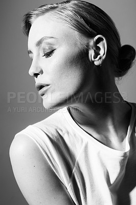 Buy stock photo Face of woman, black and white in studio for fashion, retro or classic aesthetic by gray background with light. Isolated model, edgy outfit or clothes with vintage style, lady or pose with cool art