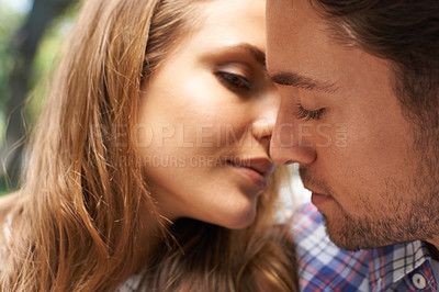 Buy stock photo Couple, face or intimate kiss on love date, valentines day or romance bonding in nature park or relax garden. Zoom, man or woman leaning for kissing in marriage security, trust or partnership emotion