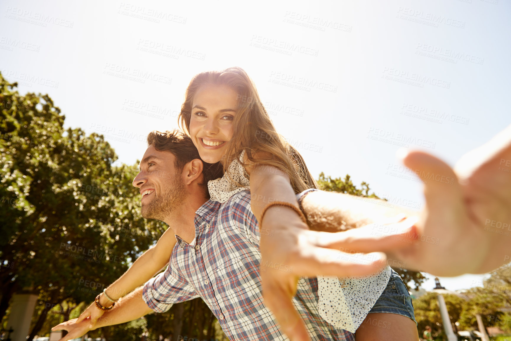 Buy stock photo Bonding couple, piggy back or airplane in nature park, garden or backyard for valentines day, relax date or romance love. Smile, happy or man carrying woman in aeroplane, fun game or freedom activity