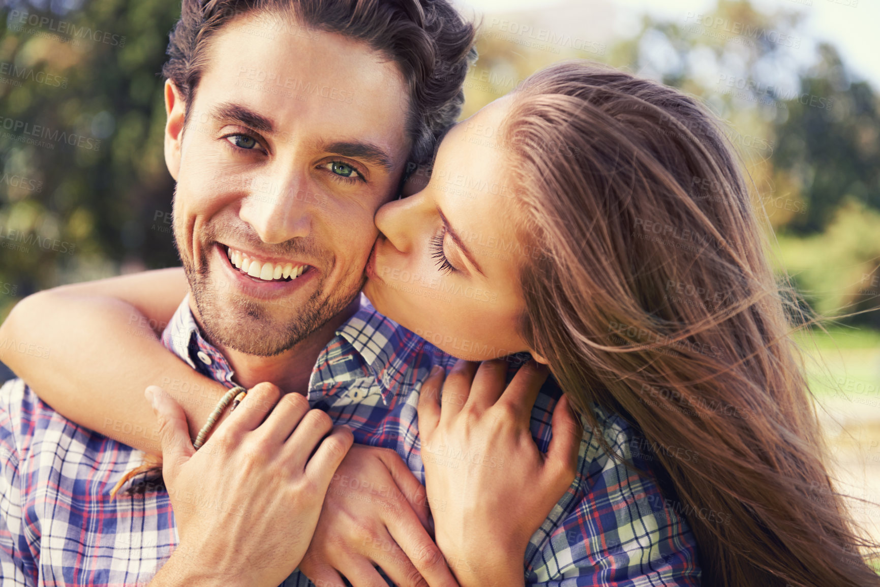 Buy stock photo Couple portrait, hug or cheek kiss on love, valentines day or romance date in park bonding, garden or relax nature. Happy, man or embrace woman in marriage security, thank you or partnership support