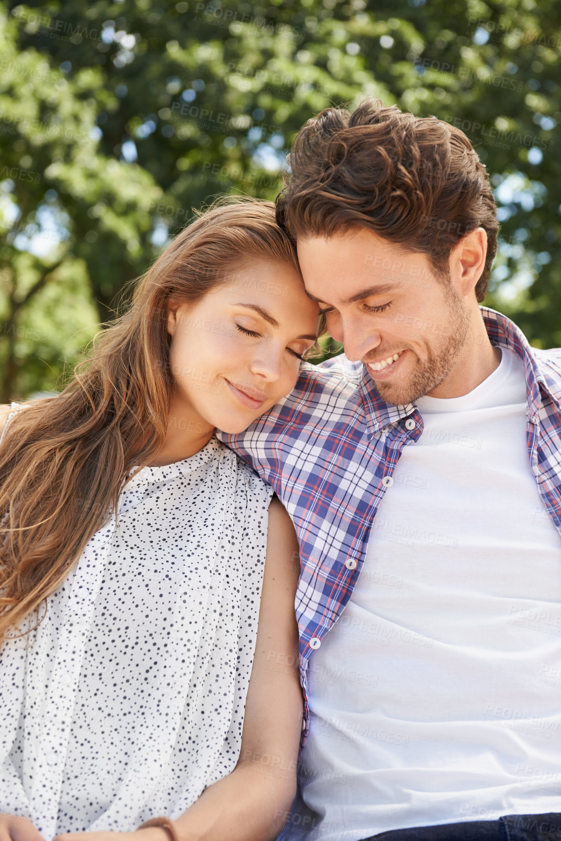 Buy stock photo Happy couple, hug and emotion on love date, valentines day or nature park romance in relax garden bonding. Smile, happy and embrace for woman and man in trust, marriage security and honeymoon support