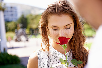 Buy stock photo Woman, smelling rose and outdoor for valentines day date at a city park with love, romance and beauty. Face of person with red flower as gift or present to celebrate Paris couple holiday in summer