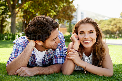 Buy stock photo Couple, portrait or love date on grass, nature park or garden bonding on valentines day, romance or anniversary celebration. Smile, happy woman or man lying in relax environment or partnership picnic