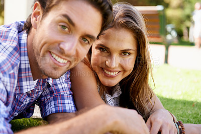 Buy stock photo Happy couple, portrait or love date on grass, nature park or garden bonding on valentines day, romance or anniversary celebration. Smile, woman or man lying in relax environment or partnership picnic