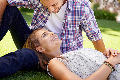 Buy stock photo Bonding couple, lying and love on grass, nature park or garden on valentines day, romance date or marriage bonding. Smile, happy woman and man in relax environment, summer rest or partnership picnic