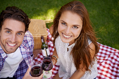 Buy stock photo Portrait, top view and couple in picnic, wine and Valentines date with smile, loving and quality time outdoor. Romantic, man and woman in park, celebration for anniversary and love on summer vacation