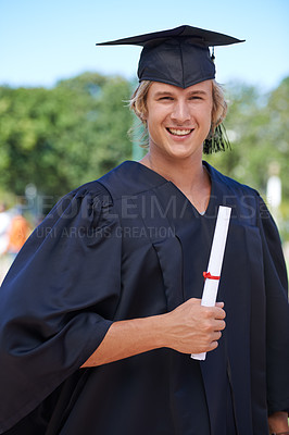 Buy stock photo Graduation, portrait and student on campus with certificate, smile and success with university education. School, scholarship and happy man with diploma for academic achievement with college degree.