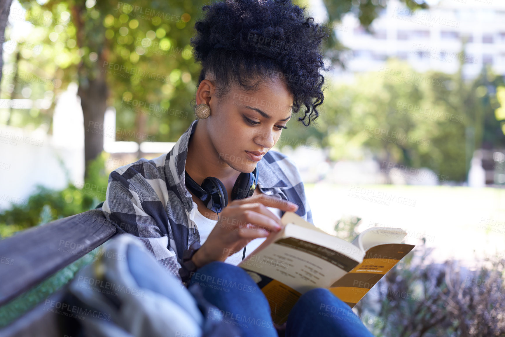 Buy stock photo Woman, student and reading on bench with book for university study, learn education or relax. Female person, academic and college campus or outdoor for knowledge, scholarship or research literature