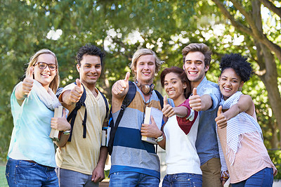Buy stock photo Portrait of a group of students smiling for the camera with their thumbs up