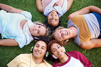 Buy stock photo Headphones, portrait or friends in park at college, campus or  together with community, smile or group. University, above or happy people bond with support, joy or radio music in education in garden