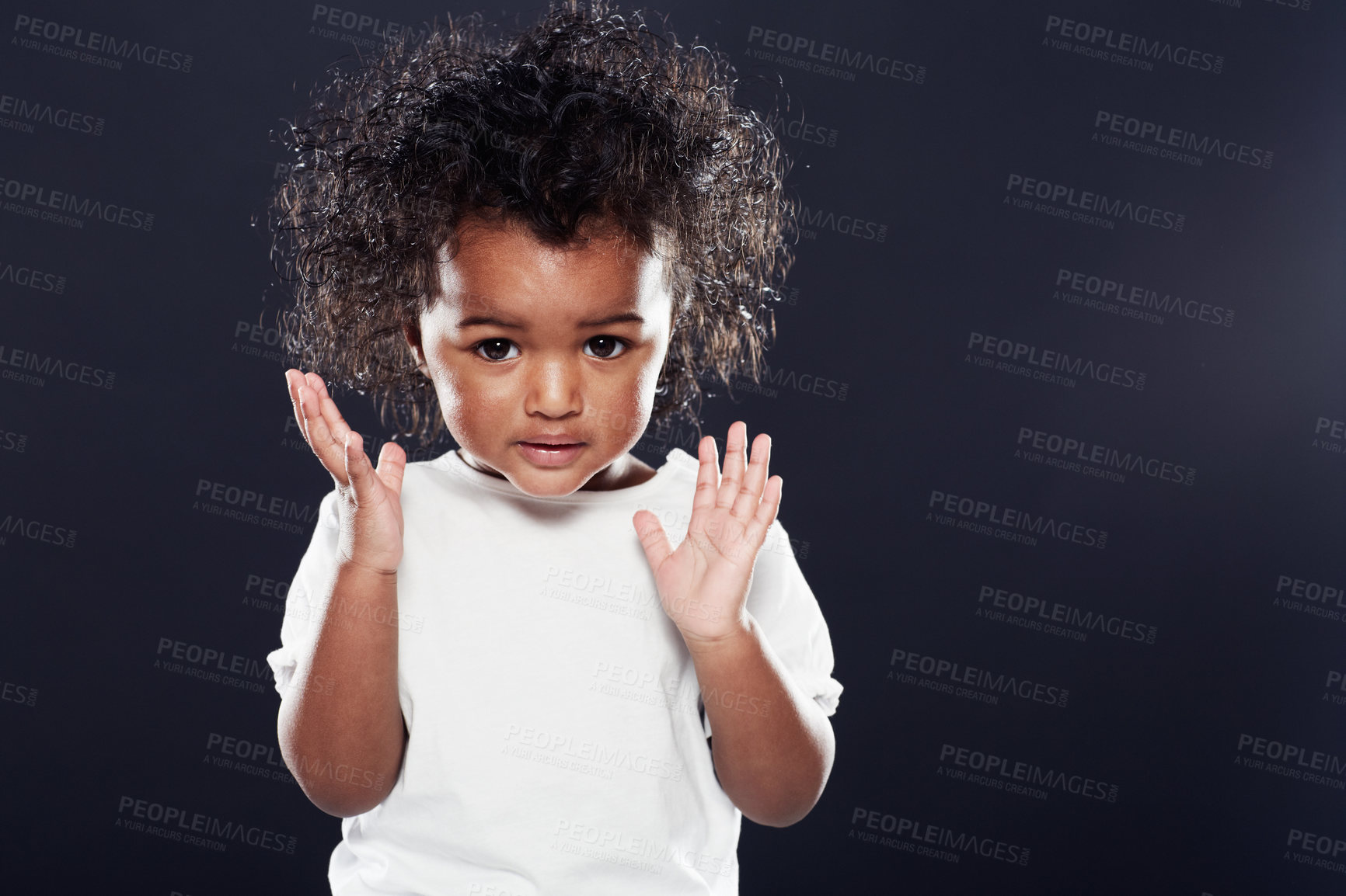 Buy stock photo Cute, kid and girl with expression, thinking and contemplation on a dark studio background. Mockup space, adorable toddler and child development with hands up and emoji with thoughts and wonder