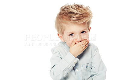 Buy stock photo A cute little boy covering his mouth with his hand - isolated