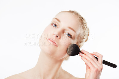 Buy stock photo Shot of beautiful woman using a cosmetic brush