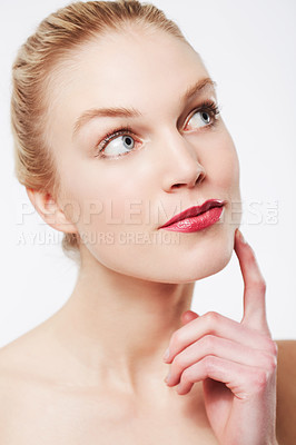 Buy stock photo Thinking, skincare and woman in red lipstick, makeup and cosmetics in studio isolated on a white background. Face, model and beauty in spa facial treatment for wellness, touch skin and healthy glow