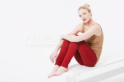 Buy stock photo Portrait of a  beautiful blonde wearing casual clothing sitting in a studio