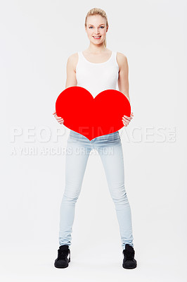 Buy stock photo Woman, studio portrait and cardboard heart with happiness for valentines day celebration by white background. Isolated model, excited and smile with poster for romance, love or dating with paper sign