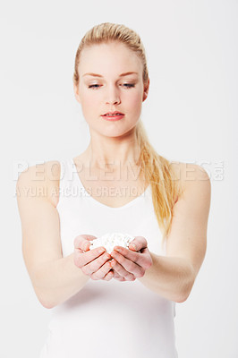 Buy stock photo Many pills, hands and woman isolated on a white background for infertility, women healthcare and drugs. Pharmaceutical medicine of person or model palm, hand holding in studio for clinic or pharmacy