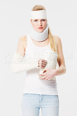 Buy stock photo Portrait, insurance and pills with an injured woman in studio on a gray background for medical aid. Healthcare, medical or injury with a young female patient in a brace and cast on blank space