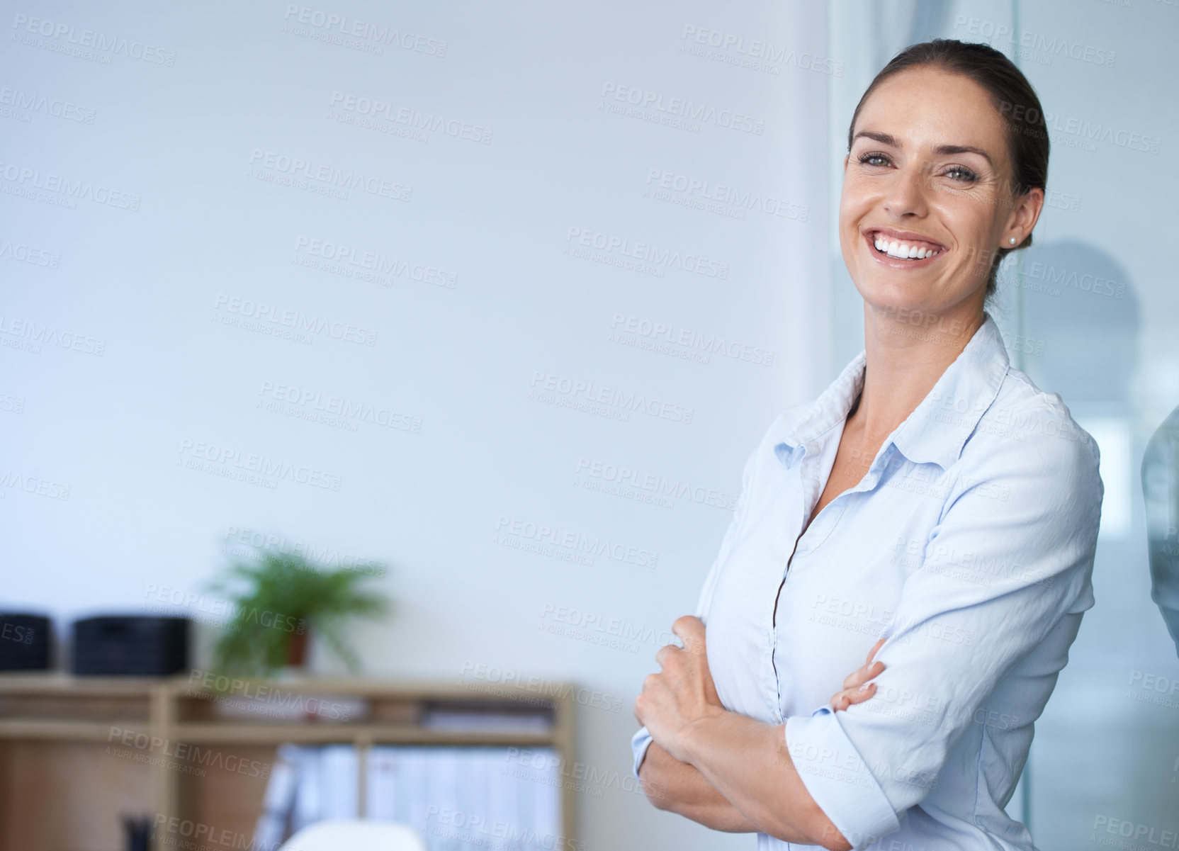 Buy stock photo A cropped shot of a smiling businesswoman in the office