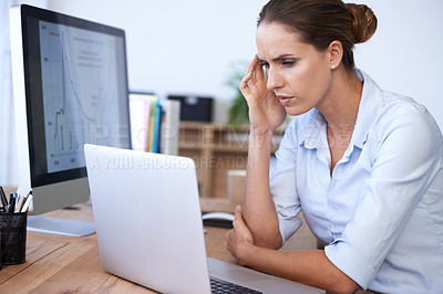 Buy stock photo A young businesswoman looking frustrated while working on her computer
