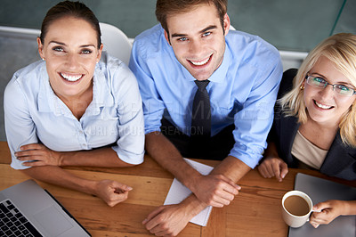 Buy stock photo Top view, portrait and happy business people at office, desk and corporate company for teamwork, collaboration and support. Face, smile and group of professional employees working together in agency