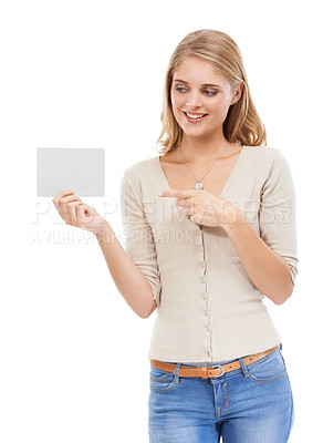 Buy stock photo Woman, pointing at card and advertising, presentation or announcement with information on poster on white background. About us, coming soon or sign up with news, marketing or ads with board in studio