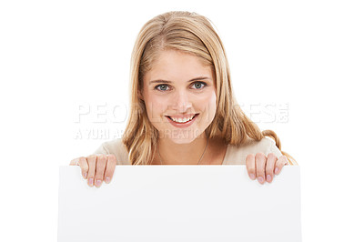 Buy stock photo Happy, portrait and woman with blank poster, sign or banner in white background and mock up. Studio, space and person with empty signage for announcement information, news on cardboard and paper