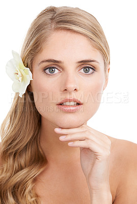 Buy stock photo Woman, portrait and confidence in studio with flower, serious and pride for cosmetic treatment or glow. Model, person or face with hand for haircare organic skincare, or self care on white background