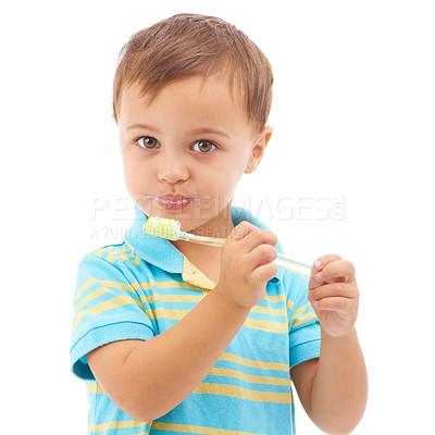 Buy stock photo Portrait, boy and kid brushing teeth in studio for hygiene, learning healthy oral habits and care on white background. Young child, toothbrush and toothpaste for dental cleaning, fresh breath or gums