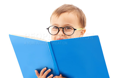 Buy stock photo Boy child, reading and book in studio, learning and development with thinking by white background. Kid, student or language in kindergarten with education, knowledge and story in glasses with ideas