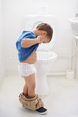 Buy stock photo Boy child, potty training and toilet with thinking, diaper and pants on floor for learning, development and progress. Kid, family home and bathroom with ideas, problem solving or solution in nappy