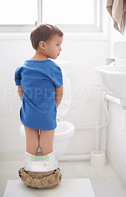 Buy stock photo Boy kid, potty training and bathroom with thinking, diaper and pants on floor for learning, development and progress. Child, family home and back in toilet with ideas, hygiene or solution with nappy